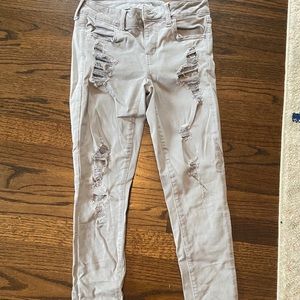 Grey ripped skinny jeans